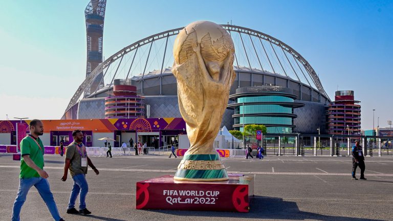 A giant replica of the FIFA World Cup trophy in front of the Khalifa International Stadiume which is one of eight stadiums in Doha that will host the FIFA World Cup in Qatar. (Jonas Ekstromer/AP)