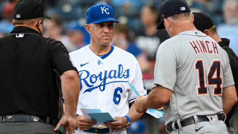 FILE - Kansas City Royals bench coach Pedro Grifol meets with Detroit Tigers manager A.J. Hinch and the umpires before the start of their baseball game in Kansas City, Mo., Monday, June 14, 2021. (Reed Hoffmann/AP)