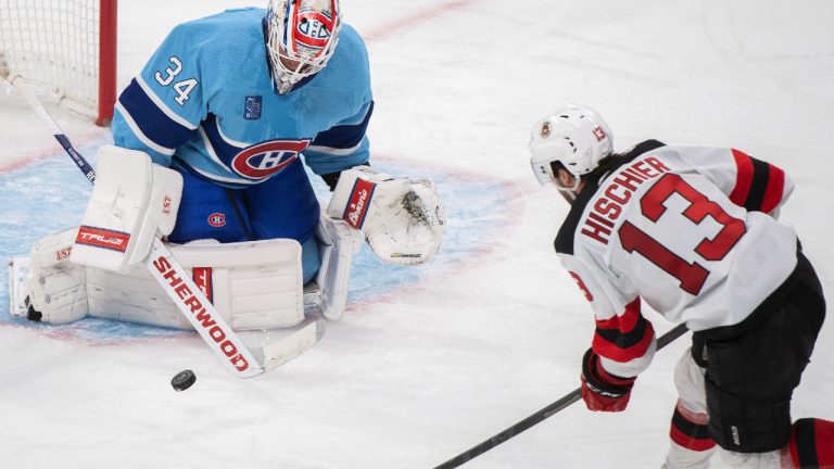 New Jersey Devils’ Nico Hischier takes a shot on Montreal Canadiens goaltender Jake Allen during second period NHL hockey action in Montreal, Tuesday, Nov. 15, 2022. (Graham Hughes/CP)