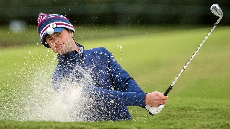 Cole Hammer hits out to a bunker on the ninth green during the first round of the RSM Classic golf tournament, Thursday, Nov. 17, 2022, in St. Simons Island, Ga. (Stephen B. Morton/AP)