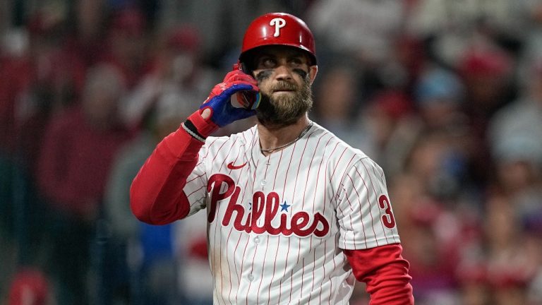 Philadelphia Phillies' Bryce Harper walks to the dugout after striking out during the fourth inning in Game 4 of baseball's World Series between the Houston Astros and the Philadelphia Phillies on Wednesday, Nov. 2, 2022, in Philadelphia. (AP Photo/David J. Phillip)