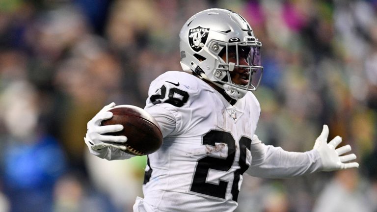 Las Vegas Raiders running back Josh Jacobs (28) celebrates as he scores the game-winning touchdown during overtime of an NFL football game against the Seattle Seahawks. (Caean Couto/AP)