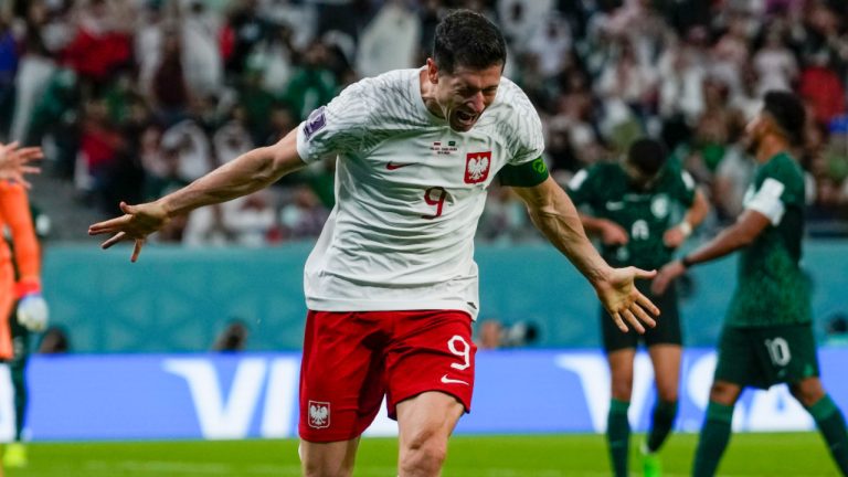 Poland's Robert Lewandowski celebrates scoring his side's 2nd goal during the World Cup group C soccer match between Poland and Saudi Arabia, at the Education City Stadium in Al Rayyan , Qatar, Saturday, Nov. 26, 2022. (Manu Fernandez/AP) 