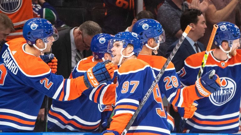 Edmonton Oilers' Connor McDavid (97) celebrates a goal against the Vancouver Canucks during third period NHL action in Edmonton on Wednesday, October 12, 2022.THE CANADIAN PRESS/Jason Franson