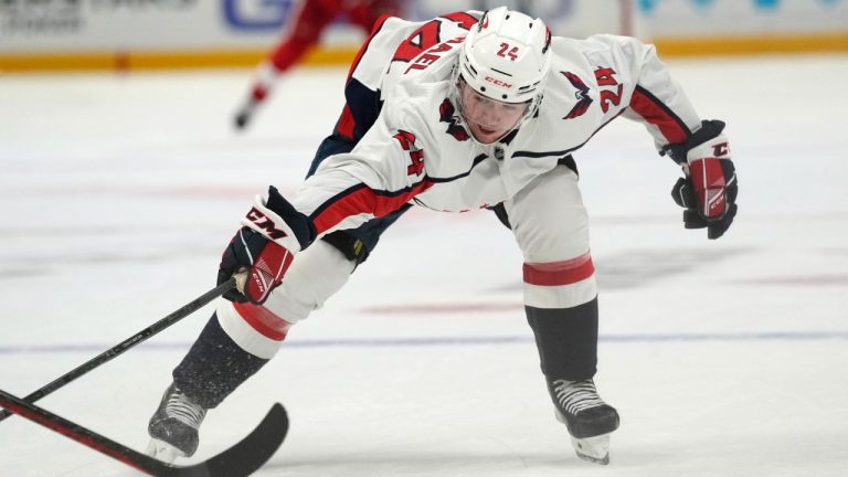 Washington Capitals centre Connor McMichael reaches for the puck during the first period of an NHL hockey game against the Detroit Red Wings, Thursday, Nov. 3, 2022, in Detroit. (Carlos Osorio/AP)