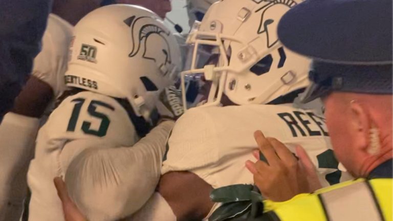 FILE - Security and police break up a scuffle between players from Michigan and Michigan State football teams in the Michigan Stadium tunnel after an NCAA college football game on Oct. 29, 2022 in Ann Arbor, Mich. Seven Michigan State football players were charged in the postgame melee in Michigan Stadium's tunnel last month, according to a statement Wednesday, Nov. 23, from the Washtenaw County Prosecutor's Office. (Kyle Austin/MLive Media Group via AP, File) 