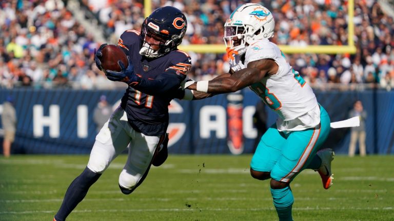 Chicago Bears wide receiver Darnell Mooney (11) runs for yardage against Miami Dolphins cornerback Kader Kohou (28) during the first half of an NFL football game, Sunday, Nov. 6, 2022 in Chicago. (Nam Y. Huh/AP)