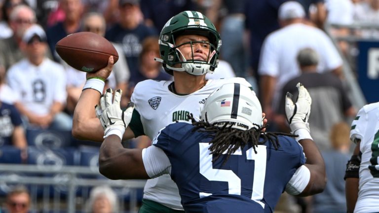 Ohio quarterback Kurtis Rourke (7) throws a pass while being pressured by Penn State defensive tackle Hakeem Beamon (51) in the first half of an NCAA college football game, Saturday, Sept. 10, 2022, in State College, Pa. (Barry Reeger/AP Photo)