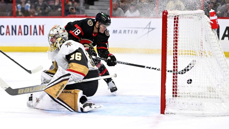 Ottawa Senators left wing Tim Stutzle (18) puts the puck in the net behind Vegas Golden Knights goaltender Logan Thompson (36) during second period NHL hockey action.  (Justin Tang/CP)