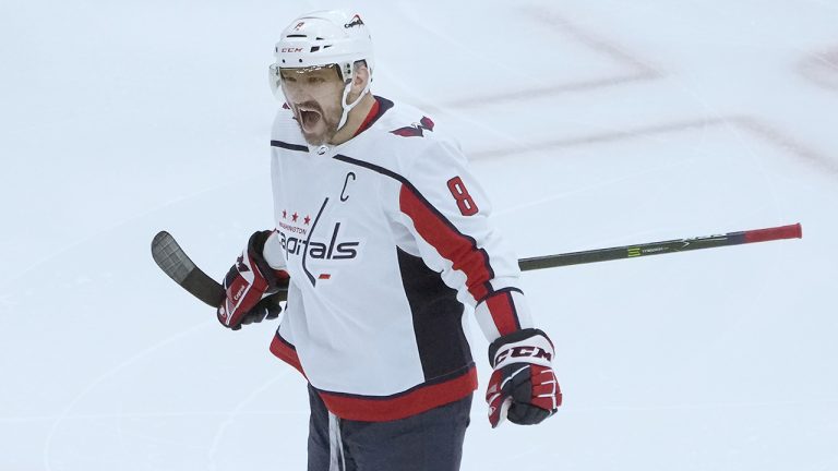 Washington Capitals' Alex Ovechkin (8) celebrates his goal during the first period of an NHL hockey game against the Chicago Blackhawks Tuesday, Dec. 13, 2022, in Chicago. (Charles Rex Arbogast/AP)