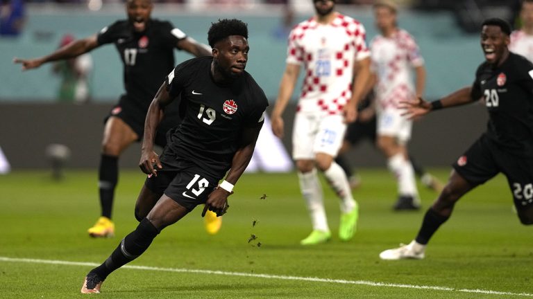 Canada's Alphonso Davies celebrates after scoring his side's opening goal during the World Cup group F soccer match between Croatia and Canada, at the Khalifa International Stadium in Doha, Qatar, Sunday, Nov. 27, 2022. (Thanassis Stavrakis/AP)