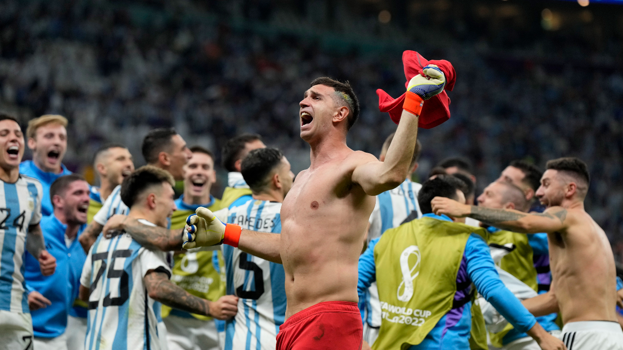 Argentina's goalkeeper Emiliano Martinez celebrates at the end of the World Cup quarterfinal soccer match between the Netherlands and Argentina, at the Lusail Stadium in Lusail, Qatar, Saturday, Dec. 10, 2022. Argentina defeated the Netherlands 4-3 in a penalty shootout after the match ended tied 2-2. (AP Photo/Ricardo Mazalan)