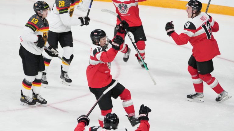 Austria’s Ian Scherzer, centre, celebrates his team’s first goal of the tournament during second period IIHF World Junior Hockey Championship action against Germany in Halifax on Friday, December 30, 2022. (Darren Calabrese/CP)