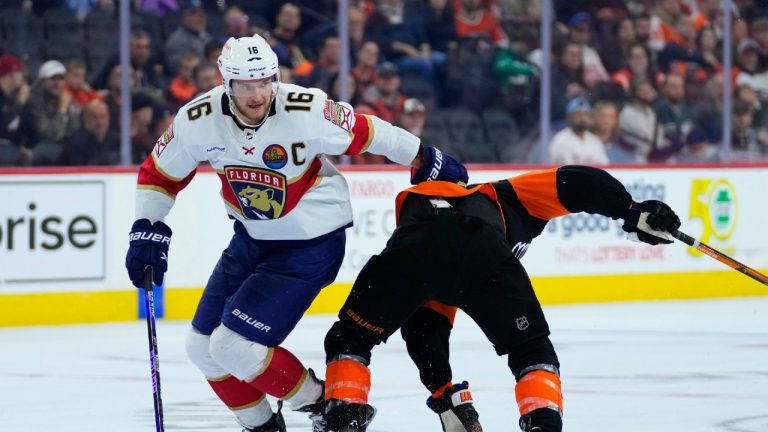 Florida Panthers' Aleksander Barkov, left, and Philadelphia Flyers' Scott Laughton collide during the third period of an NHL hockey game, Thursday, Oct. 27, 2022, in Philadelphia. (Matt Slocum/AP)