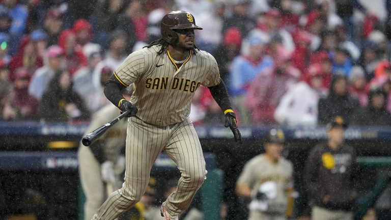 San Diego Padres' Josh Bell watches his RBI-double during the seventh inning in Game 5 of the baseball NL Championship Series between the San Diego Padres and the Philadelphia Phillies on Sunday, Oct. 23, 2022, in Philadelphia. (Matt Slocum/AP)