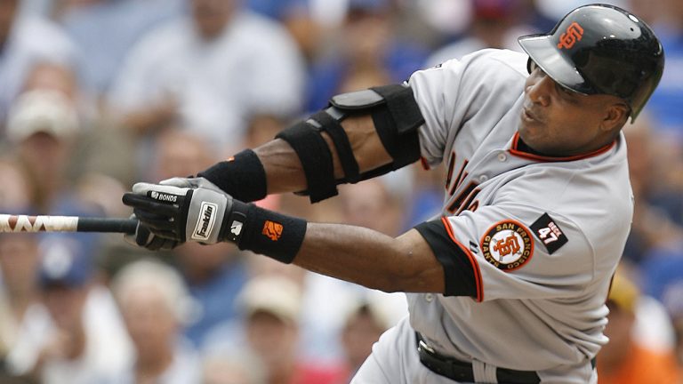 Former San Francisco Giants outfielder Barry Bonds hits a single against the Chicago Cubs during the third inning of a baseball game Thursday, July 19, 2007, in Chicago. (Nam Y. Huh/AP)