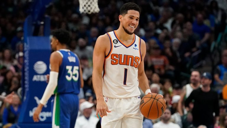 Phoenix Suns guard Devin Booker reacts to a foul called against him during the fourth quarter of an NBA basketball game against the Dallas Mavericks in Dallas, Monday, Dec. 5, 2022. (LM Otero/AP Photo)