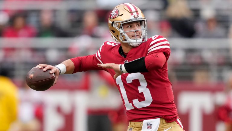 San Francisco 49ers quarterback Brock Purdy (13) throws a touchdown pass to running back Christian McCaffrey during the first half of an NFL football game against the Tampa Bay Buccaneers in Santa Clara, Calif., Sunday, Dec. 11, 2022. (Tony Avelar/AP)