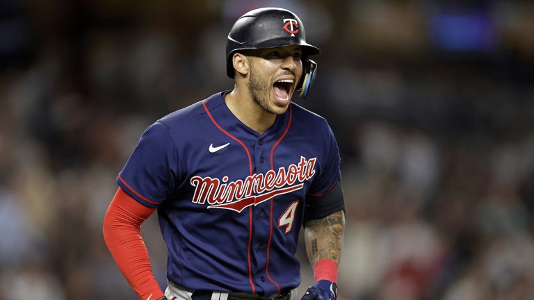 Minnesota Twins' Carlos Correa reacts after hitting a two-run home run against the New York Yankees during the eighth inning of a baseball game Thursday, Sept. 8, 2022, in New York. (Adam Hunger/AP)