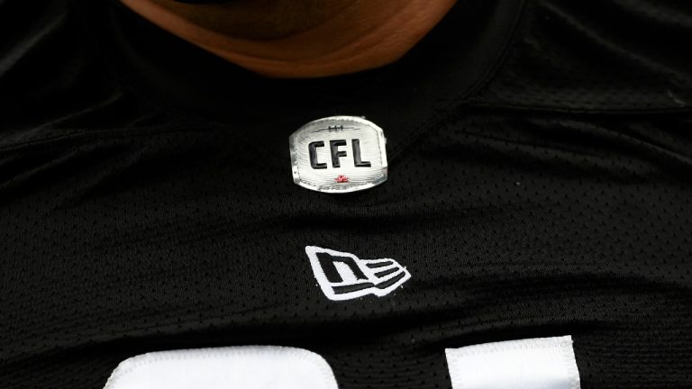 The CFL logo is seen on a jersey during the Redblacks training camp in Ottawa on Thursday, May 19, 2022. Justin Tang/THE CANADIAN PRESS