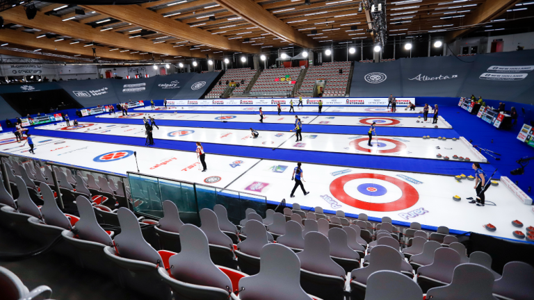 Play gets underway as cardboard cutouts of fans look on at the Scotties Tournament of Hearts in Calgary, Alta., Friday, Feb. 19, 2021 (Jeff McIntosh/CP)