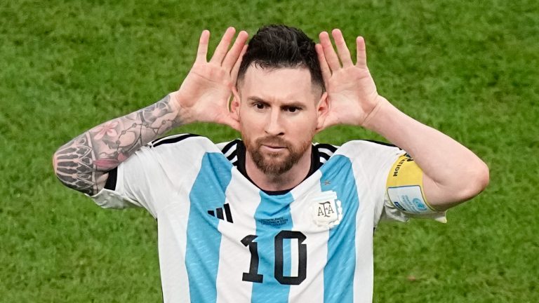 Argentina's Lionel Messi celebrates after scoring during the World Cup quarterfinal soccer match between the Netherlands and Argentina. (Ariel Schalit/AP)