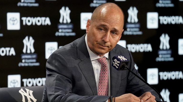 Brian Cashman, general manager and senior vice president of the New York Yankees, announces that the team failed to secure a multi-year deal with right fielder Aaron Judge (99) before their opening day baseball game against the Boston Red Sox, Friday, April 8, 2022, in New York. (John Minchillo/AP)