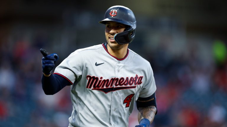 Carlos Correa rounds the bases after hitting a two-run home run against the Cleveland Guardians during the seventh inning of a baseball game Monday, June 27, 2022, in Cleveland. (Ron Schwane/AP)