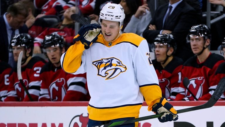 Nashville Predators right wing Eeli Tolvanen (28) reacts after scoring on New Jersey Devils goaltender Mackenzie Blackwood during the second period of an NHL hockey game. (John Minchillo/AP)