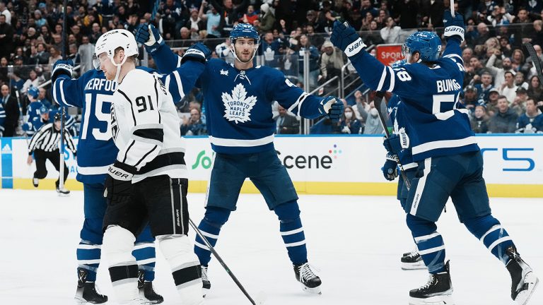 Toronto Maple Leafs' Pierre Engvall (centre) celebrates scoring as Los Angeles Kings' Carl Grundstrom skates past during second period NHL hockey action in Toronto, on Thursday, December 8, 2022.(Chris Young/CP)