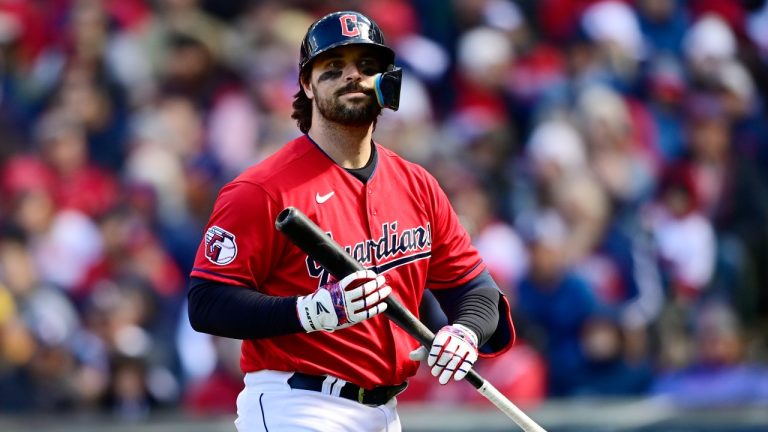 Cleveland Guardians' Austin Hedges walks back to the dugout after striking out in the eighth inning of a wild card baseball playoff game against the Tampa Bay Rays, Saturday, Oct. 8, 2022, in Cleveland. (David Dermer/AP Photo)