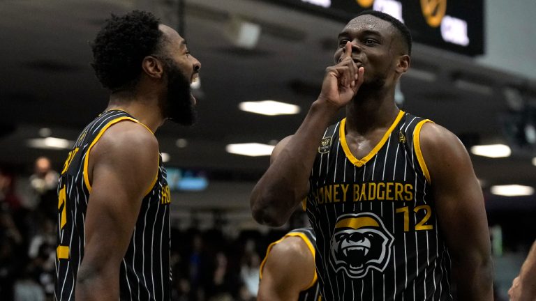 Hamilton Honey Badgers guard Aaron Best (left) rand guard Caleb Agada react after Caleb scored the game winning basket during the CEBL championship final, Sunday, August 14, 2022 in Ottawa. (Adrian Wyld/CP)