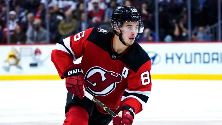 New Jersey Devils centre Jack Hughes (86) skates with the puck during the second period of the team's NHL hockey game against the Nashville Predators, Thursday, Dec. 1, 2022, in Newark, N.J. (Julia Nikhinson/AP)