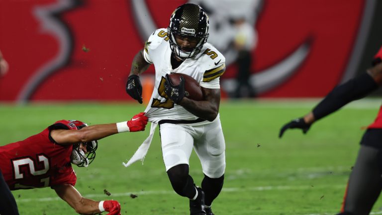 New Orleans Saints wide receiver Jarvis Landry (5) carries as Tampa Bay Buccaneers cornerback Zyon McCollum (27) tries to bring him down in the second half of an NFL football game in Tampa, Fla., Monday, Dec. 5, 2022. (Mark LoMoglio/AP)