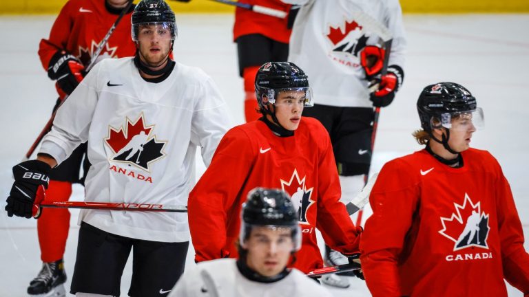 Canada’s national junior team defenceman Olen Zellweger, centre, skates with teammates during a training camp practice in Calgary, Tuesday, Aug. 2, 2022. (Jeff McIntosh/The Canadian Press)