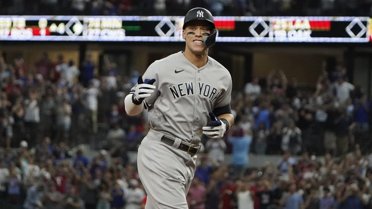 New York Yankees' Aaron Judge gestures as he runs the bases after hitting a solo home run, his 62nd of the season, during the first inning in the second baseball game of a doubleheader against the Texas Rangers in Arlington, Texas, Tuesday, Oct. 4, 2022. (LM Otero/AP)