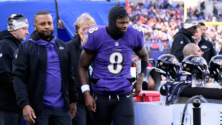 Baltimore Ravens quarterback Lamar Jackson (8) leaves the injury tent and heads toward the locker room, during the first half of an NFL football game against the Denver Broncos, Sunday, Dec. 4, 2022, in Baltimore. (Nick Wass/AP)