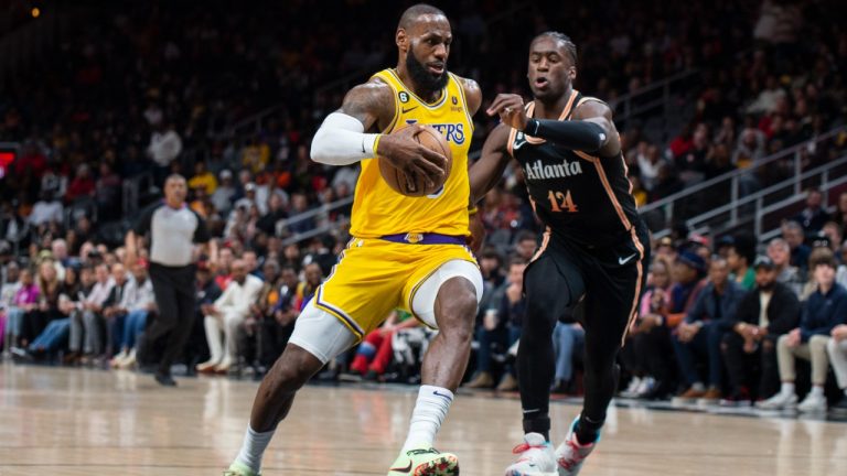 Los Angeles Lakers forward LeBron James drives to the basket against Atlanta Hawks forward AJ Griffin during the first half of an NBA basketball game Friday, Dec. 30, 2022, in Atlanta. (Hakim Wright Sr./AP Photo)