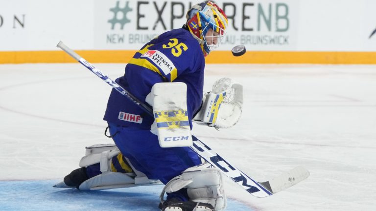 Sweden goaltender Carl Lindbom makes a save during second period IIHF World Junior Hockey Championship hockey action against Germany in Halifax on Tuesday, December 27, 2022. (Darren Calabrese/CP)