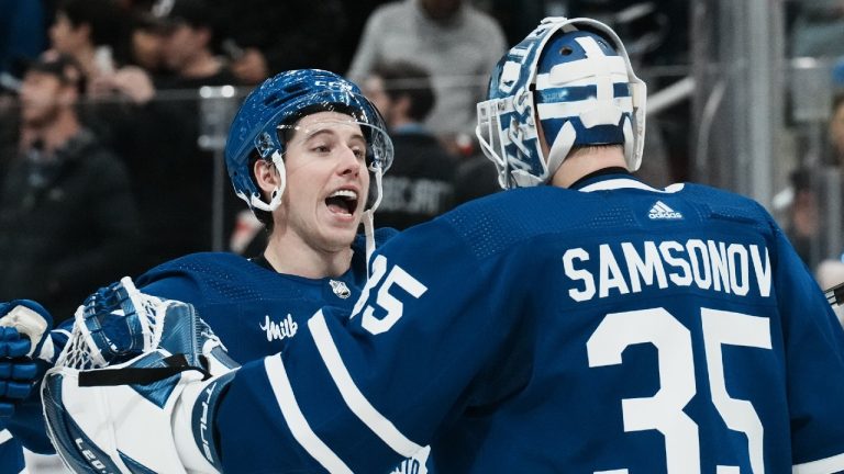 Toronto Maple Leafs' Mitchell Marner (left) celebrates with goaltender Ilya Samsonov after defeating the Los Angeles Kings in NHL hockey action in Toronto, on Thursday, December 8, 2022. Chris Young/THE CANADIAN PRESS