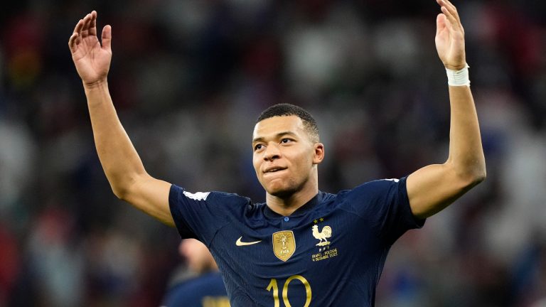 France's Kylian Mbappe celebrates scoring his side's third goal during the World Cup round of 16 soccer match between France and Poland, at the Al Thumama Stadium in Doha, Qatar. (Martin Meissner/AP)