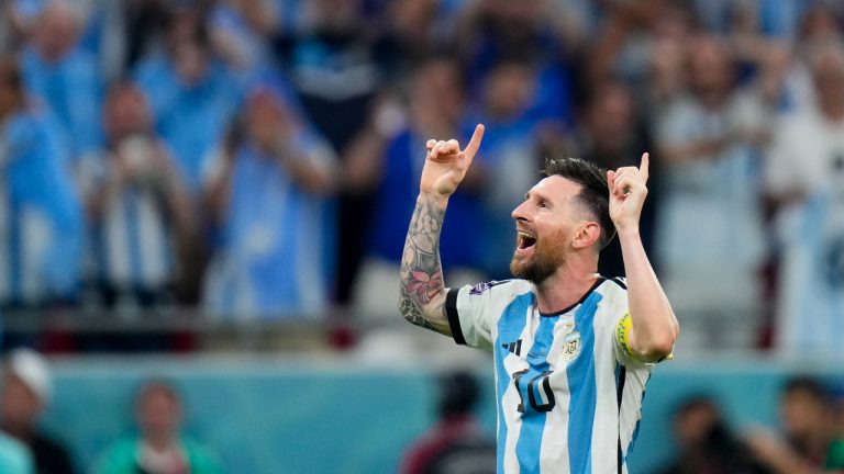 Argentina's Lionel Messi celebrates winning the World Cup round of 16 soccer match between Argentina and Australia at the Ahmad Bin Ali Stadium in Doha, Qatar. (Petr David Josek/AP)