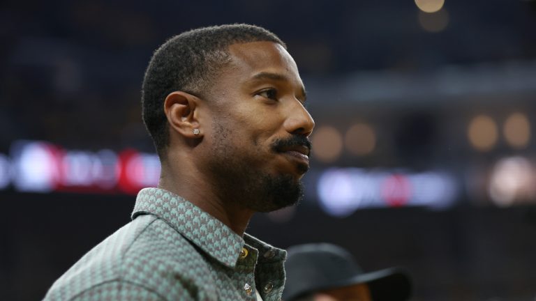 Michael B. Jordan watches during the first half of Game 2 of basketball's NBA Finals between the Golden State Warriors and the Boston Celtics in San Francisco, Sunday, June 5, 2022. (AP Photo/Jed Jacobsohn)