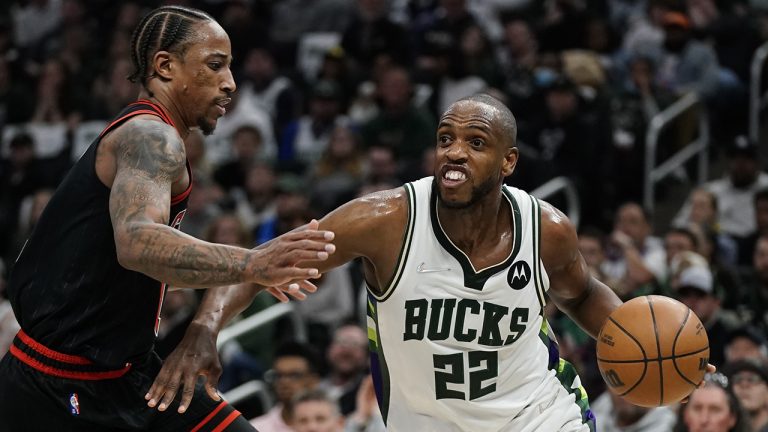 Milwaukee Bucks' Khris Middleton drives past Chicago Bulls' DeMar DeRozan during the first half of Game 1 of their first round NBA playoff basketball game Sunday, April 17, 2022, in Milwaukee. (Morry Gash/AP)