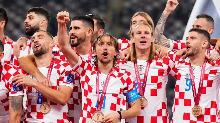 Croatia's players celebrate with their medals after the World Cup third-place playoff soccer match between Croatia and Morocco at Khalifa International Stadium in Doha, Qatar, Saturday, Dec. 17, 2022. Croatia won 2-1. (Hassan Ammar/AP)