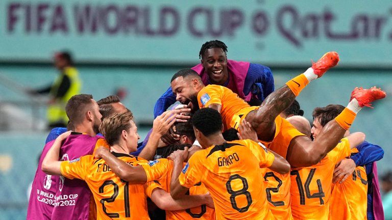 Players of the Netherlands celebrate their side's second goal by Daley Blind during the World Cup round of 16 soccer match between the Netherlands and the United States, at the Khalifa International Stadium in Doha, Qatar, Saturday, Dec. 3, 2022. (Martin Meissner/AP)