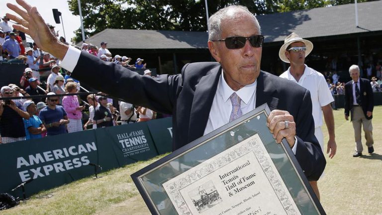 Nick Bollettieri holds his plaque as he waves to the crowd after his induction into the International Tennis Hall of Fame in Newport, R.I., Saturday, July 12, 2014. Nick Bollettieri, the Hall of Fame tennis coach who worked with some of the sport’s biggest stars. (Michael Dwyer/AP)