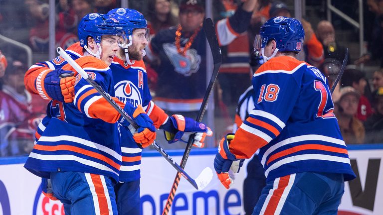 Edmonton Oilers' Ryan Nugent-Hopkins (93), Leon Draisaitl (29) and Zach Hyman (18) celebrate a goal against the Montreal Canadiens during second period NHL action in Edmonton on Saturday, December 3, 2022. (Jason Franson/CP)