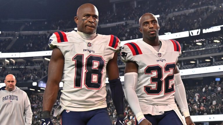 New England Patriots wide receiver Matthew Slater (18) and safety Devin McCourty walk off the field after their 30-24 loss to the Las Vegas Raiders during an NFL football game. (AP Photo/David Becker)