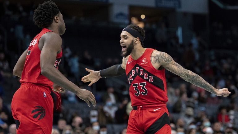 Toronto Raptors guard Gary Trent Jr., right, celebrates with forward OG Anunoby during the second half of an NBA basketball game against the Charlotte Hornets in Charlotte, N.C., Monday, Feb. 7, 2022. (Jacob Kupferman/AP)